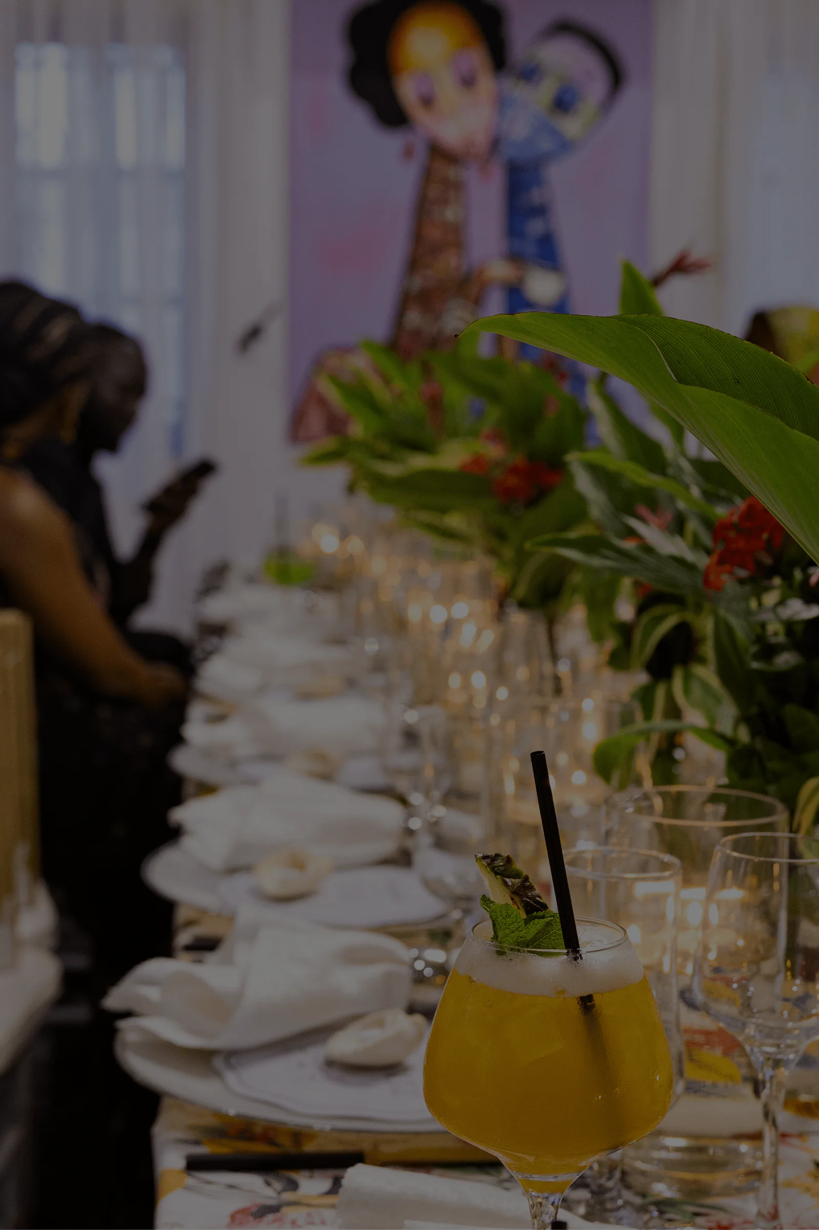 Intimate wedding reception tablescape with tropical florals and cocktails